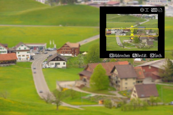 Miniatur-Landschaft: Die normale Aufnahme wurde in der D800 mit der kamerainternen Bildbearbeitung mit einem Miniatureffekt versehen. Rechts ist ein Screenshot des entsprechenden Kameramenüs eingesetzt. Für den Effekt wird ein scharfer Bereich gewählt.
