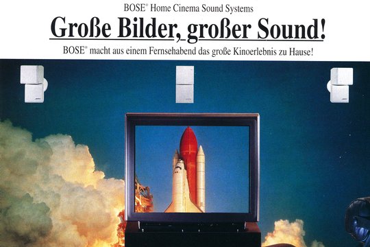 Hier in einem Inserat aus dem Jahre 1994. Das Bild steht für die Wucht der kleinen Lautsprecher beim Surroun-Sound. Damit wird Kinoerlebnis ohne sperrige Lautsprecher möglich.